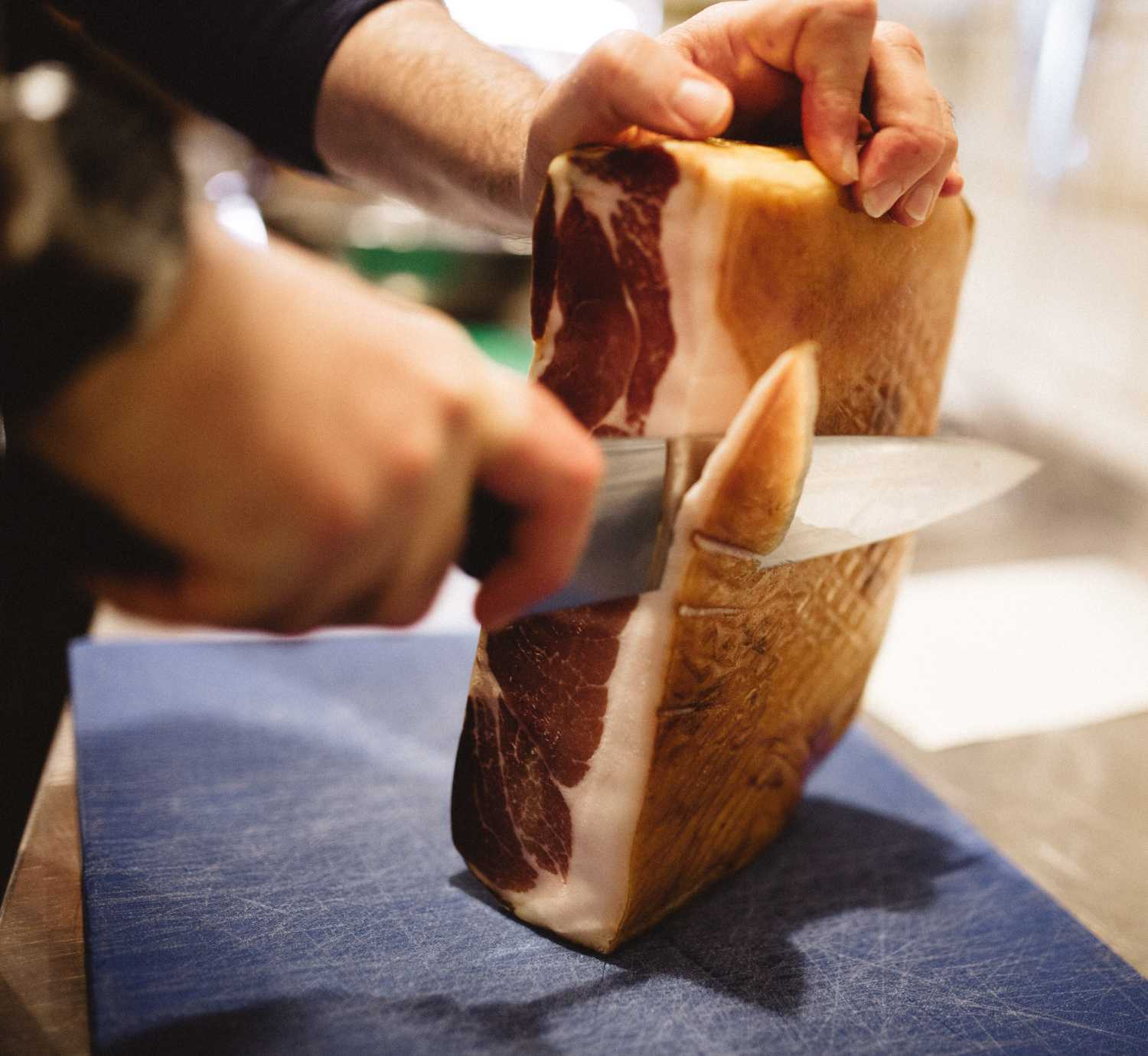 cutting parma ham